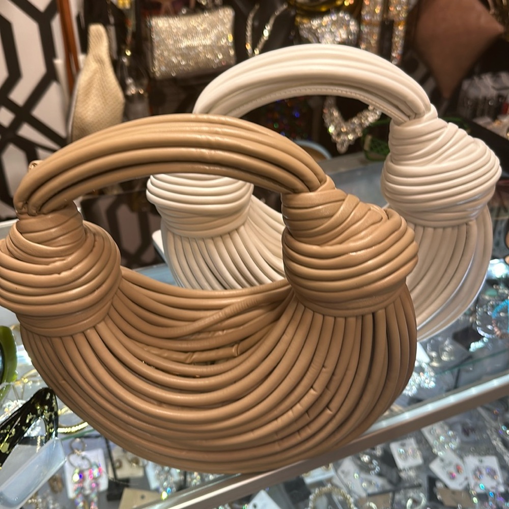 A rope purse holds very few items example phone lipstick keys handheld purse